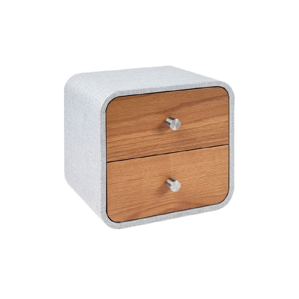 Kleine nachttafel met houten lades en stofomslag